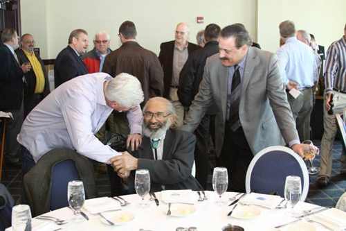 Bill Trice seated at banquet table